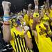 Michigan freshman Derek Engebretson and his brother junior Alex, both of Novi, dance during pre game at Crisler Center on Tuesday night. Melanie Maxwell I AnnArbor.com